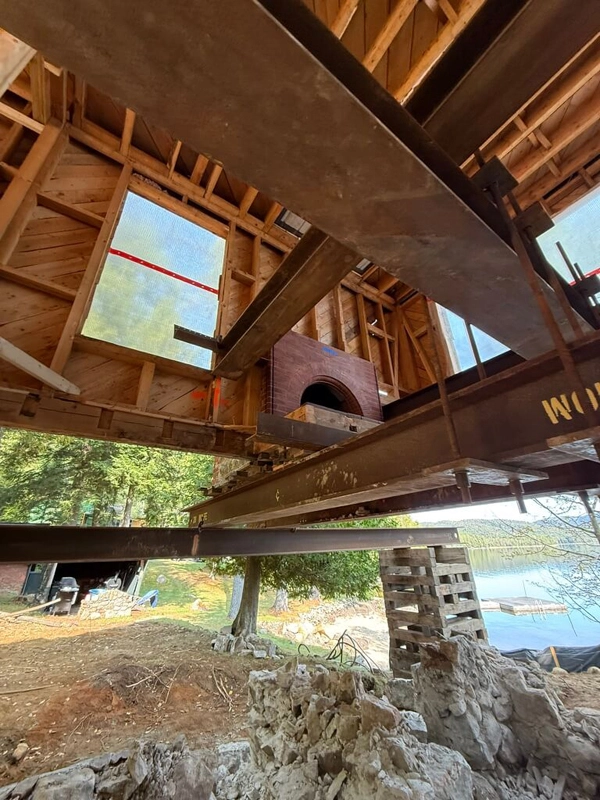 Structural beam installation during a home renovation and addition project in the Adirondacks
